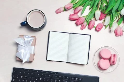 Breakfast on table. flat lay composition with flowers, a notepad a cup o coff Stock Photos