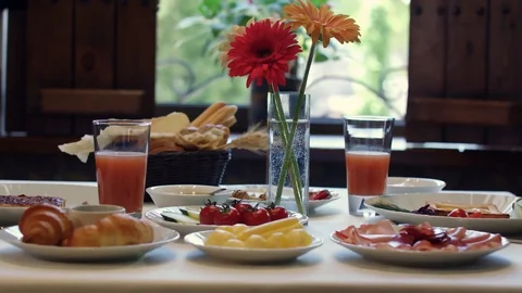 Breakfast table with flowers Stock Footage 129428356