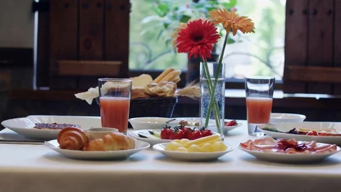 Breakfast table with flowers Stock Footage 129428366