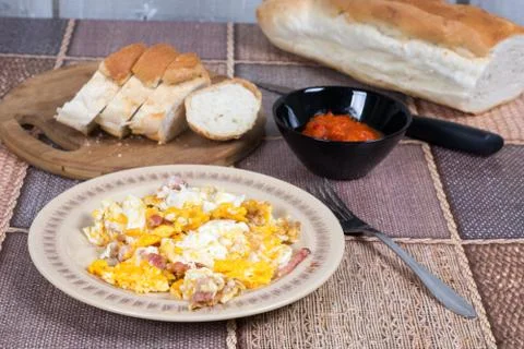 Breakfast table with fried eggs and bacon Stock Photos