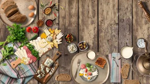 Breakfast table with great vegetable and cheeses from top view Stock Illustration