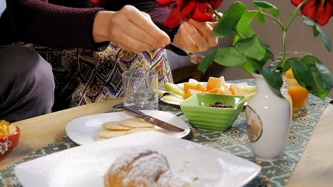 Breakfast on table people putting jam closeup Stock Footage 102671546