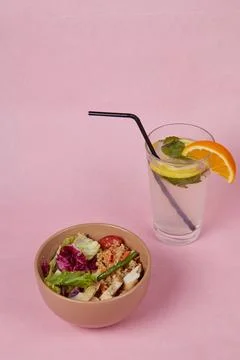 Breakfast on table, rice with vegetables and drink, side view, monochromatic Stock Photos