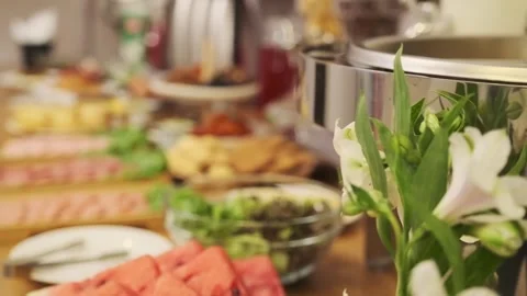 A breakfast table is set in a small hotel. Sausages, yogurt, salads, sauces Stock Footage 262850942