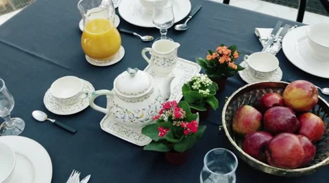 Breakfast on the table. Tea, croissants and fruits Video stock 68825543