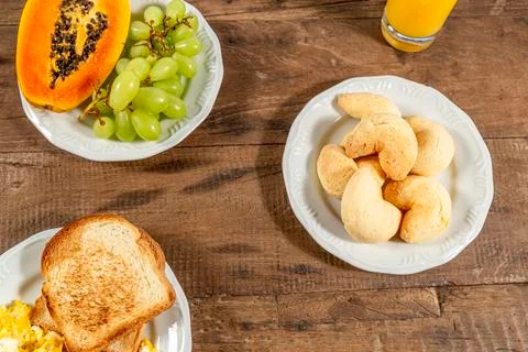 Breakfast table, top view. Toast and eggs, and a glass of orange juice. A whi Stock Photos