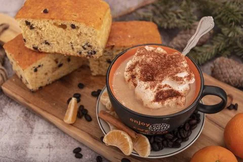 Breakfast on table with waffles, sponge cake, coffe and mandarin. Stock Photos