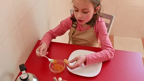 Breakfast with Tea, Jam, and Fresh Bread on a Red Table Featuring Hygienic Setup Stock Footage 302851459