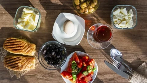 Breakfast with tea on wooden table Stock Footage 137829177