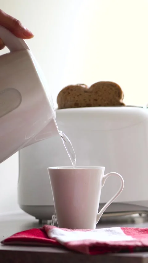 Breakfast time with white electric kettle, toaster and an old vintage radio.. Stock Footage 285543544