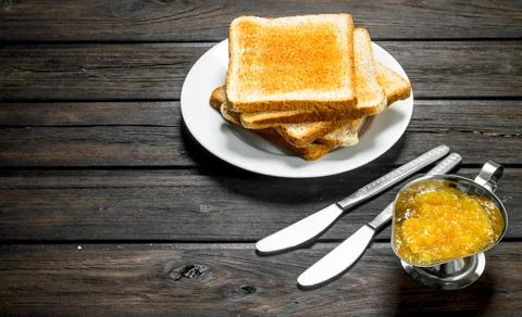 Breakfast. Toasted bread with fruit jam. Stock Photos