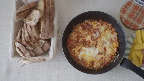 Breakfast top view with food on table delicious shakshuka bread fruit and g.. Stock Footage 332097704