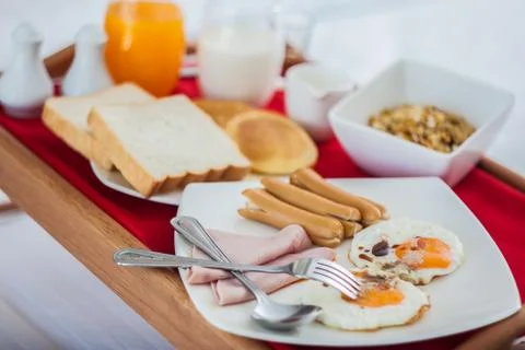 Breakfast on tray in bed Stock Photos