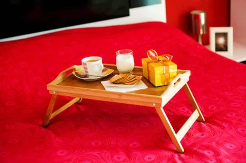 Breakfast tray on the bed Stock Photos