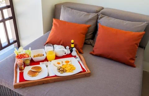 Breakfast in tray on bed Stock Photos