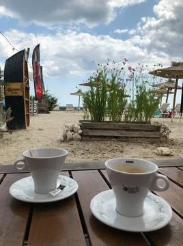 Breakfast for two in a cafe on the beach, romantic. Stock Photos