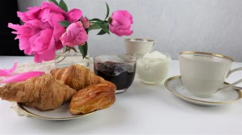 Breakfast with two cups of coffee and croissants Stock Photos