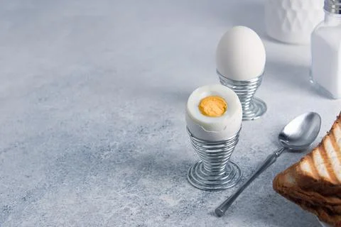 Breakfast of two hard-boiled eggs and toast. Stock Photos