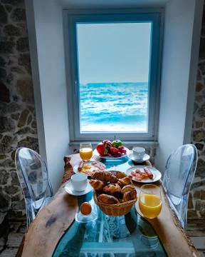Breakfast with a view over the ocean from the window, Cefalu, medieval village Stock Photos
