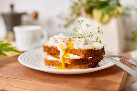 Breakfast on white bed sheets, good morning, toast with poached eggs, coffee Stock Photos