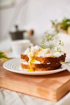 Breakfast on white bed sheets, good morning, toast with poached eggs, coffee Stock Photos