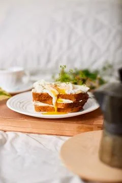 Breakfast on white bed sheets, good morning, toast with poached eggs, coffee Stock Photos