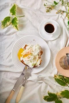 Breakfast on white bed sheets, good morning, toast with poached eggs, coffee Stock Photos
