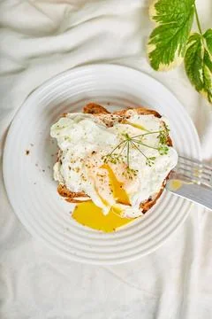Breakfast on white bed sheets, good morning, toast with poached eggs, coffee Stock Photos