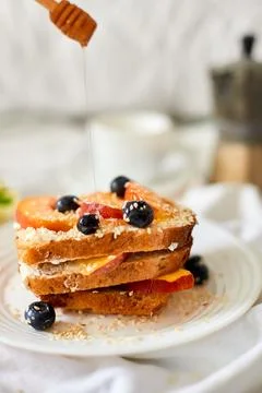 Breakfast on white bed sheets, good morning, summer french toast Stock Photos