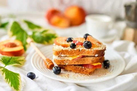 Breakfast on white bed sheets, good morning, summer french toast Stock Photos