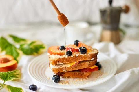 Breakfast on white bed sheets, good morning, summer french toast Stock Photos