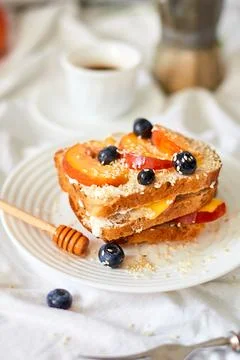 Breakfast on white bed sheets, good morning, summer french toast Stock Photos