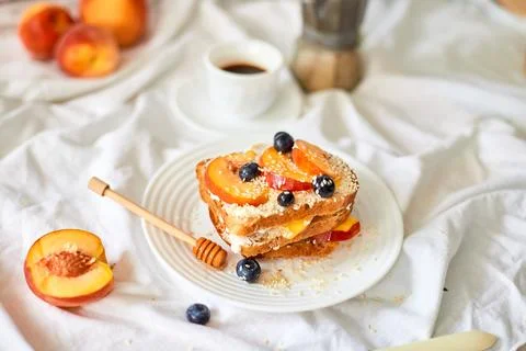 Breakfast on white bed sheets, good morning, summer french toast Stock Photos