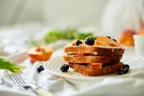 Breakfast on white bed sheets, good morning, summer french toast Stock Photos