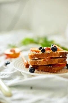 Breakfast on white bed sheets, good morning, summer french toast Stock Photos