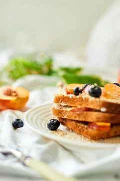 Breakfast on white bed sheets, good morning, summer french toast Stock Photos