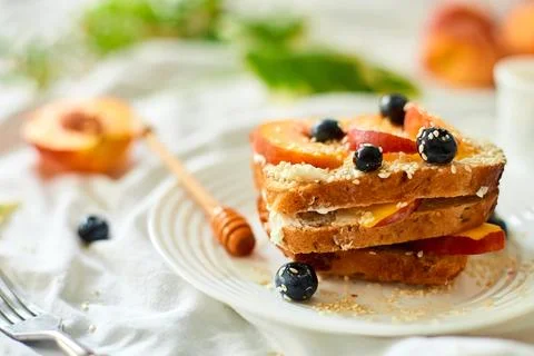 Breakfast on white bed sheets, good morning, summer french toast Stock Photos