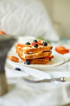Breakfast on white bed sheets, good morning, summer french toast Stock Photos
