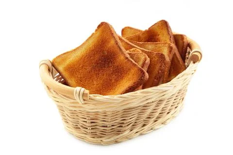 Breakfast. White toasted bread in basket isolate on white background. Top vie Stock Photos