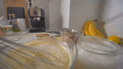 Breaking a blend for pancakes whisk. making pancakes. Stock-Footage 113057156