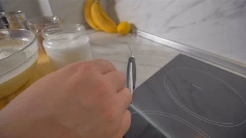 Breaking a blend for pancakes whisk. making pancakes. Stock Footage 113059158