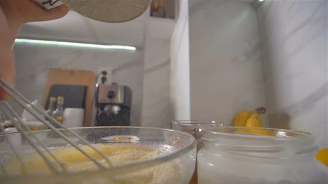 Breaking a blend for pancakes with wire breakage. making pancakes. Stock Footage 113057824
