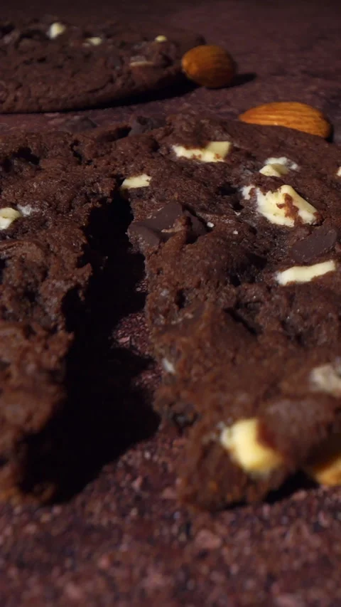 Breaking Chocolate Cookie Close-Up with Nuts and Soft Crumb Texture Camera Stock Footage 333542271