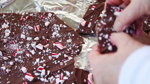 Breaking up chocolate peppermint bark Video stock 102733410