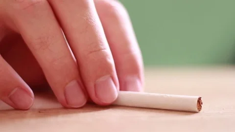 Breaking the cigarette closeup Stock Footage 81584313