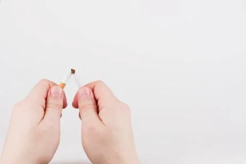 Breaking a cigarette Stock Photos