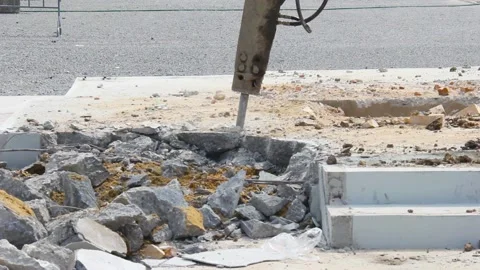 Breaking concrete with machine drilling or pneumatic hammer Stock Footage 231016712