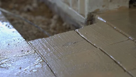 Breaking up concrete with a sledge hammer at a construction site Stock Footage 172531665