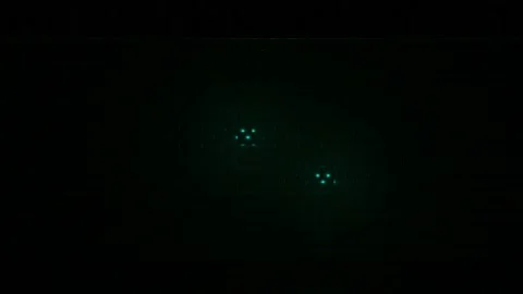 Breaking dark brick wall, concept of reconstruction. Design. Green lights behind Stock Footage 161482664