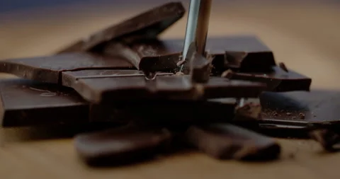 Breaking Dark Chocolate in Super Slow motion 1000 fps Video stock 161799979
